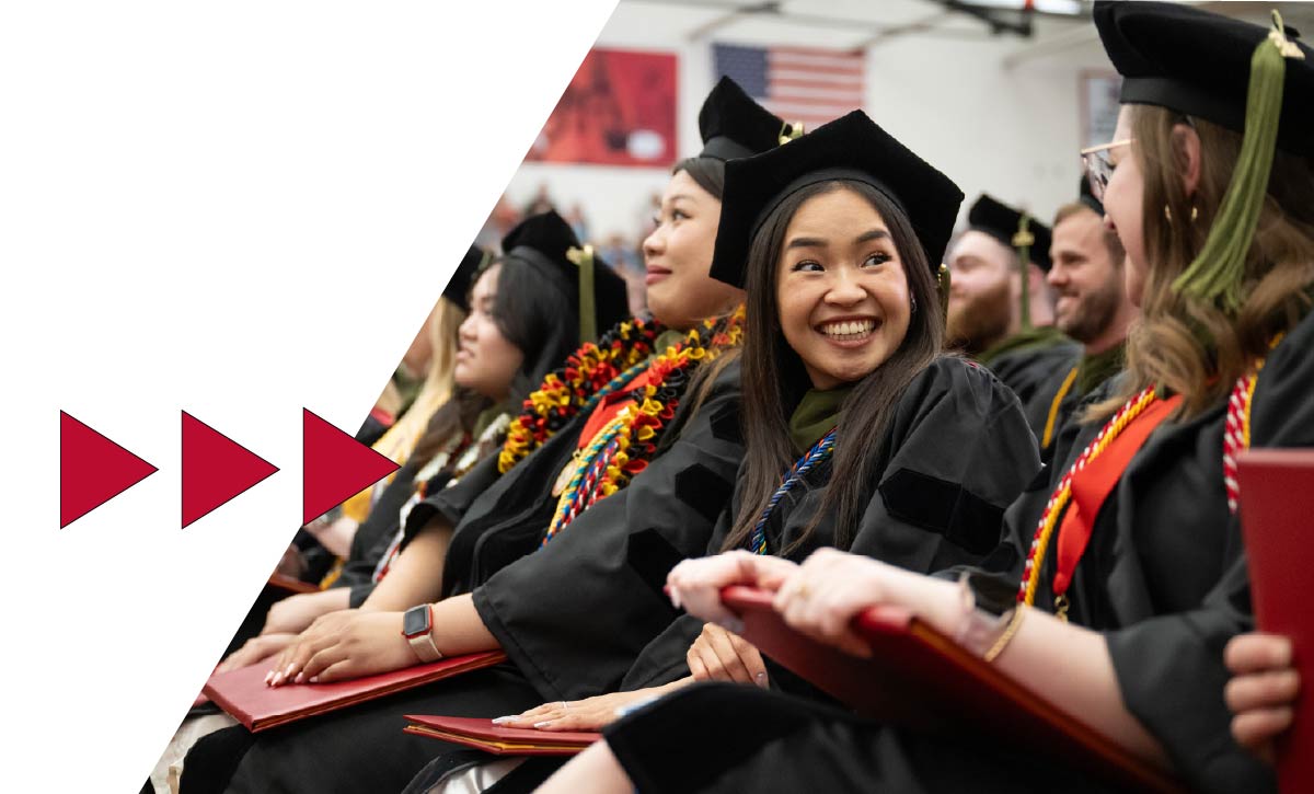 Students with diploma at Ferris State commencement ceremony