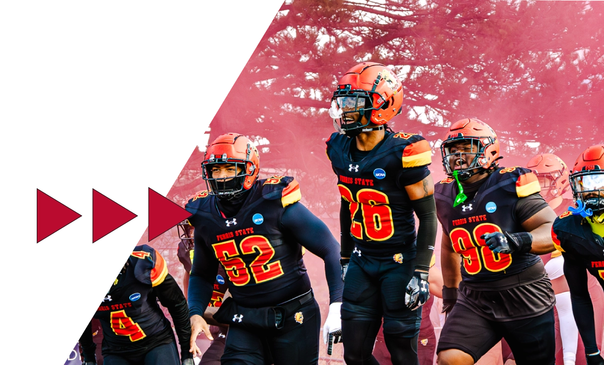 Ferris State University football players entering the field in a pre-game celebration