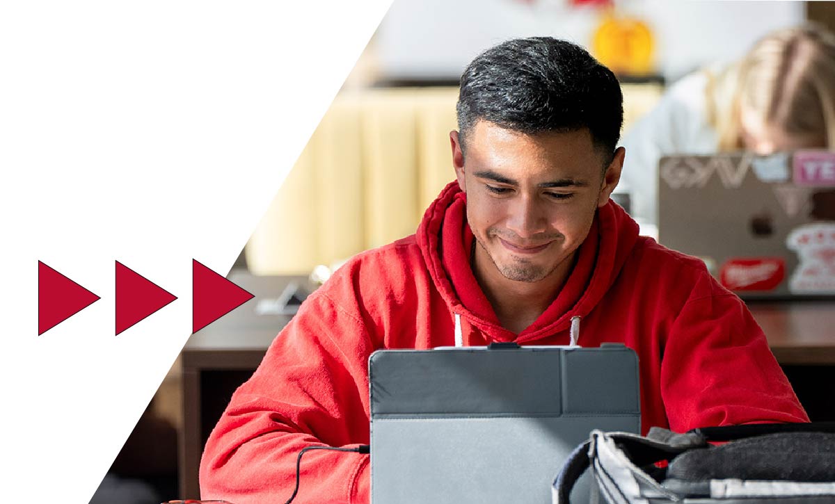 Ferris State University student working on laptop
