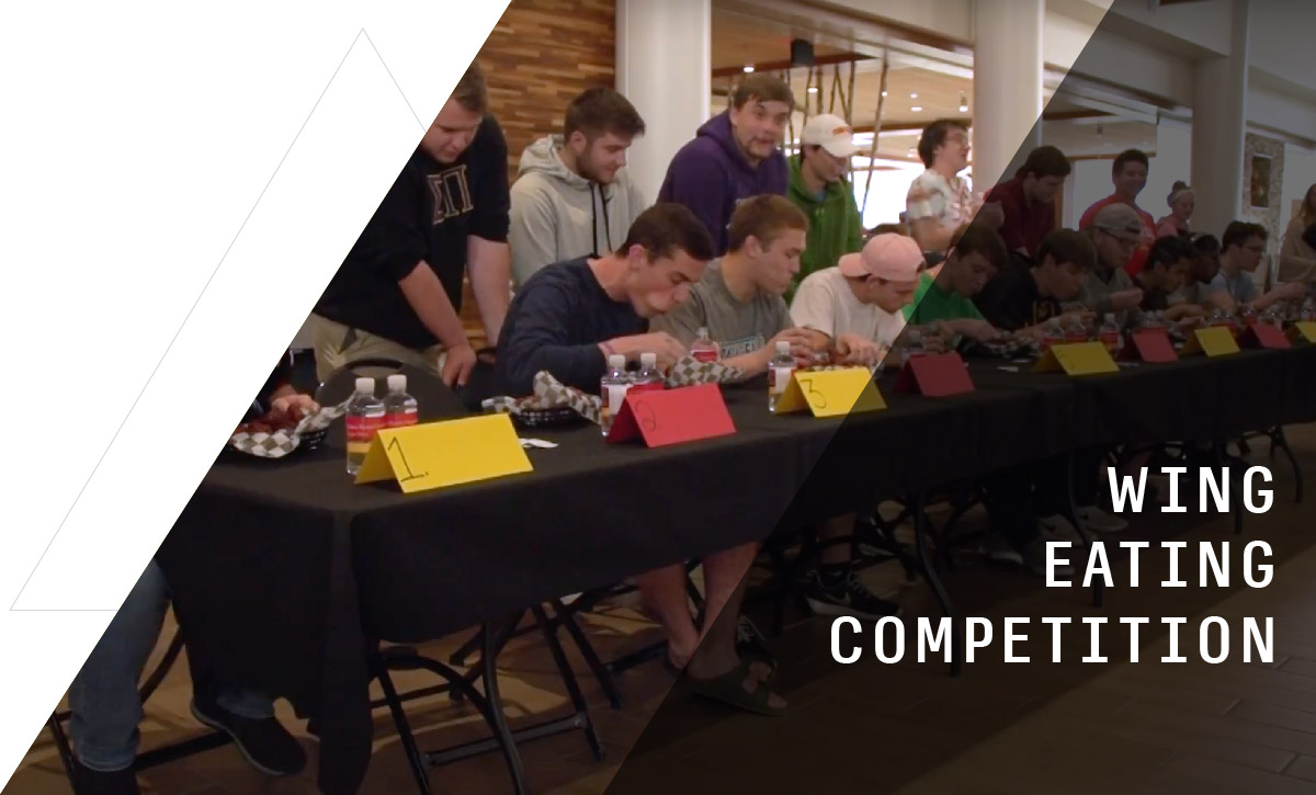 Students competing in a wing eating competition at Ferris State University's Quad Cafe