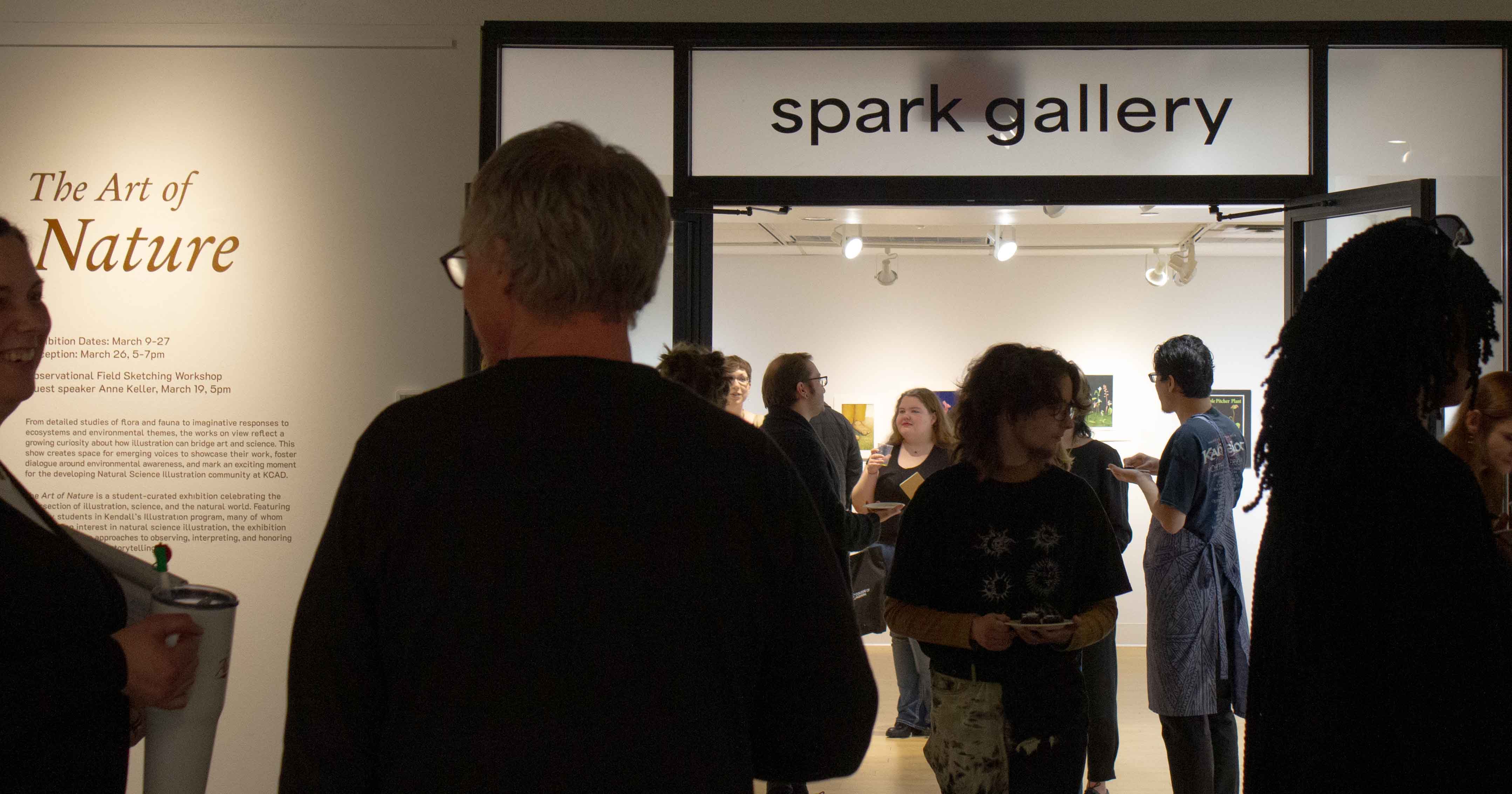 Attendees gathering for an event at the exhibit.