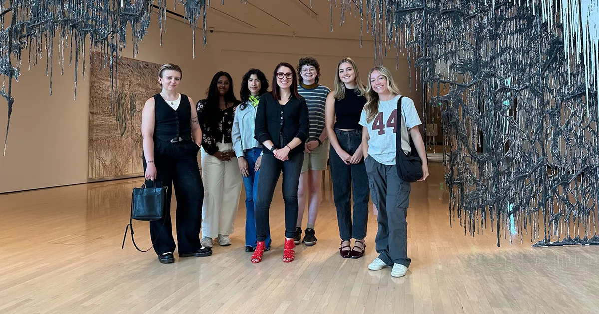 ArtPrize interns from Ferris State standing in an art gallery