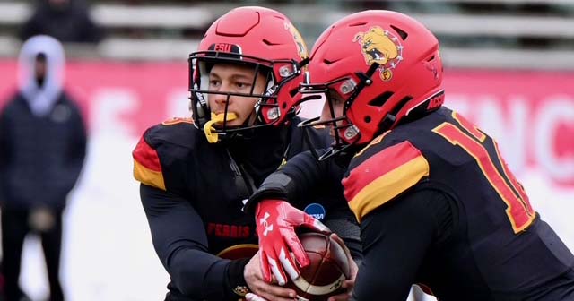Chase Carter handing the ball off to Carson Gulker