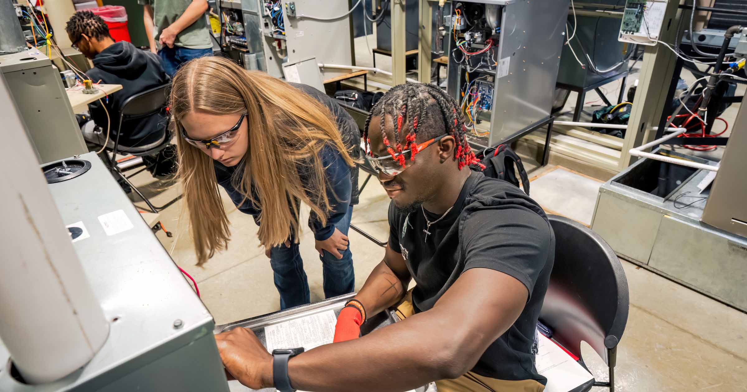 Students getting hands-on HVACR experience at Ferris State University's College of Engineering Technology.