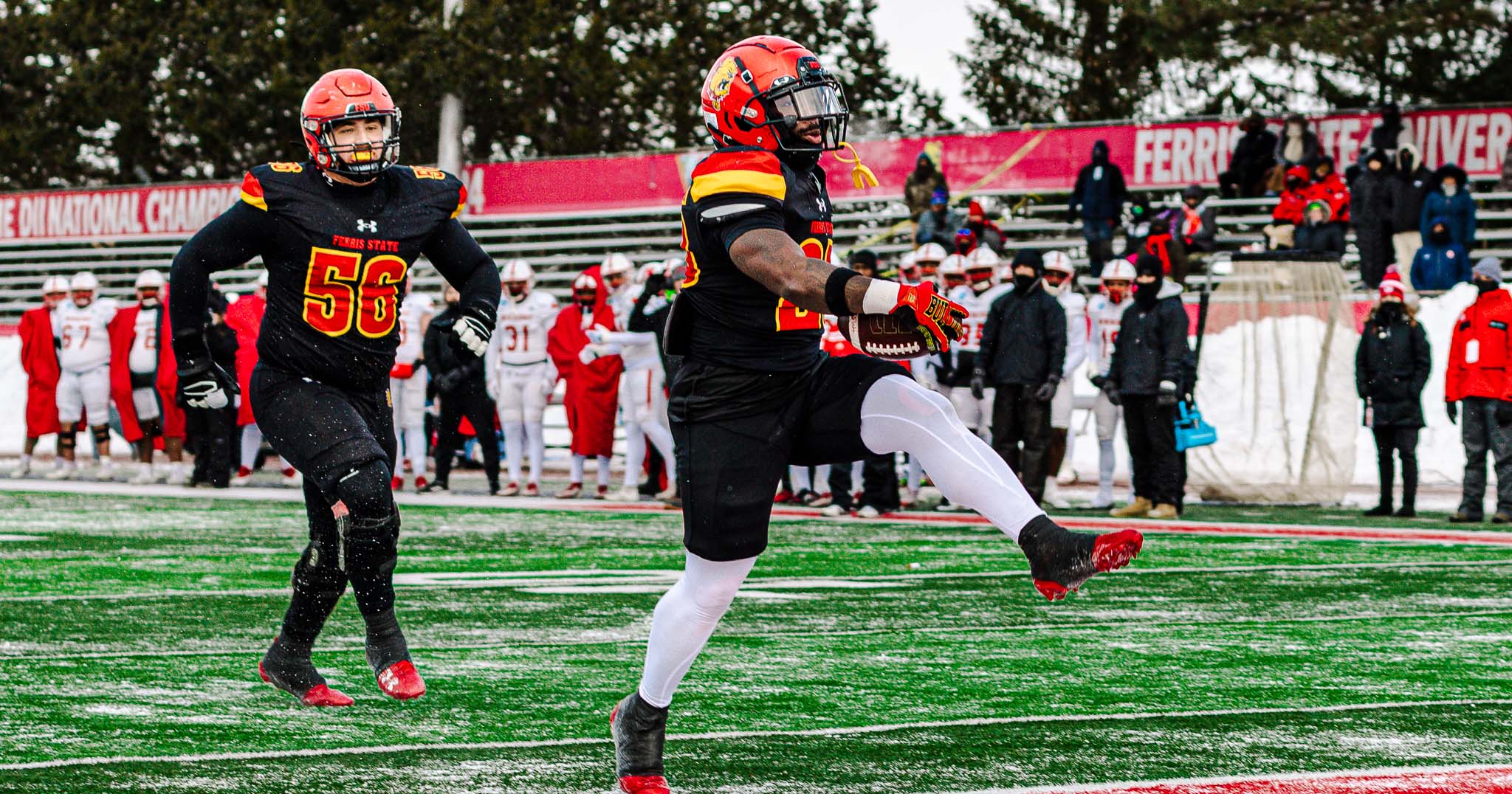Jake Price (right) celebrating one of his three rushing touchdowns against Newberry.