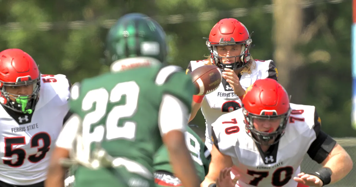 Ferris State quarterback Wyatt Bower takes a snap in Saturday's game against Lake Erie University.