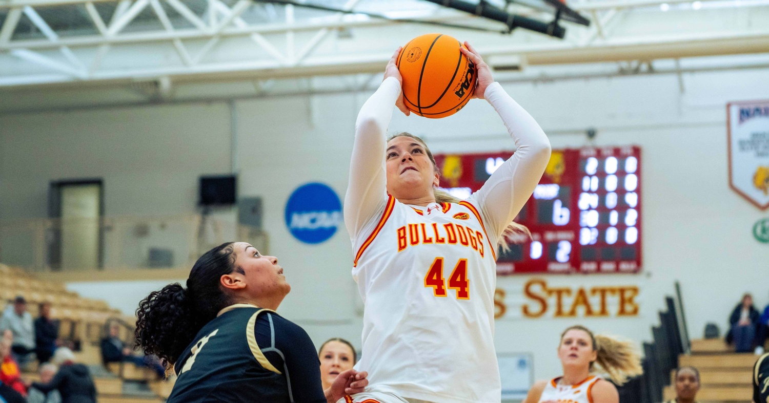 Mya Hiram attempting to score over a defender