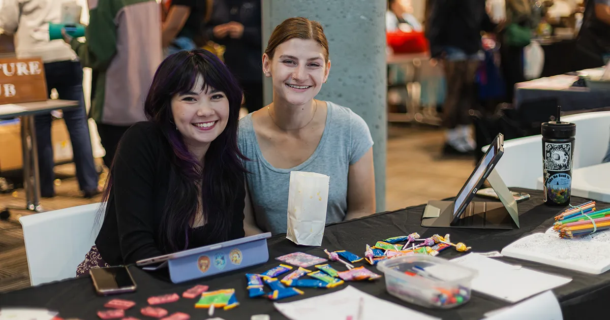 students at a table for their registered student organization