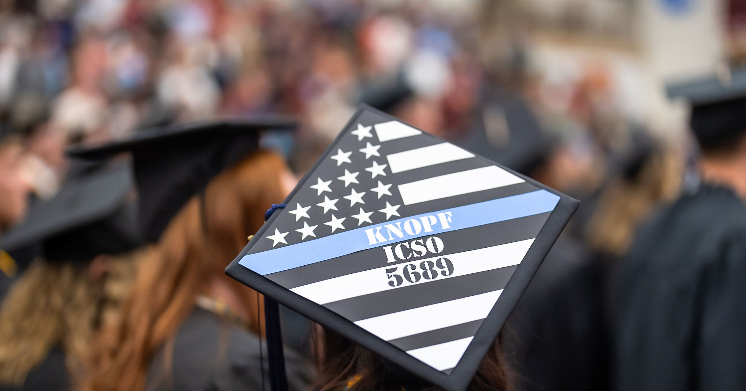 Alanna Knopf's mortarboard at commencement in spring 2026.