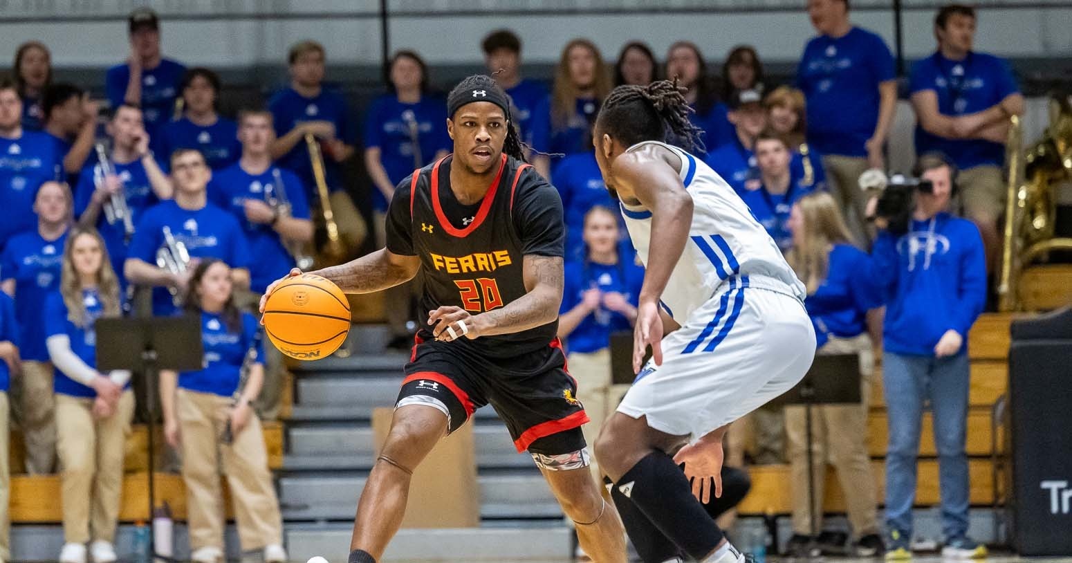 Tae Boyd (#20) sizing up a Grand Valley State defender.