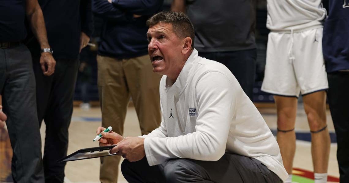 Miller drawing up a play in the middle of a timeout in a past game.