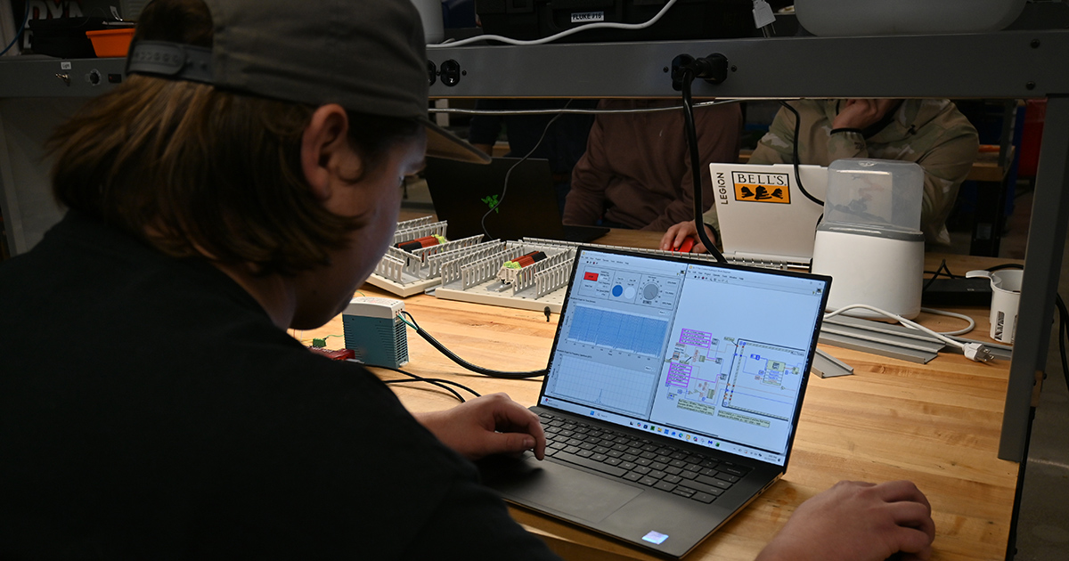 MET student working on a lab via computer.