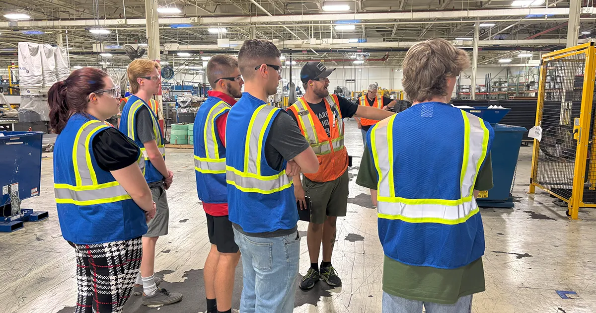 operations and supply chain management students on a plant tour
