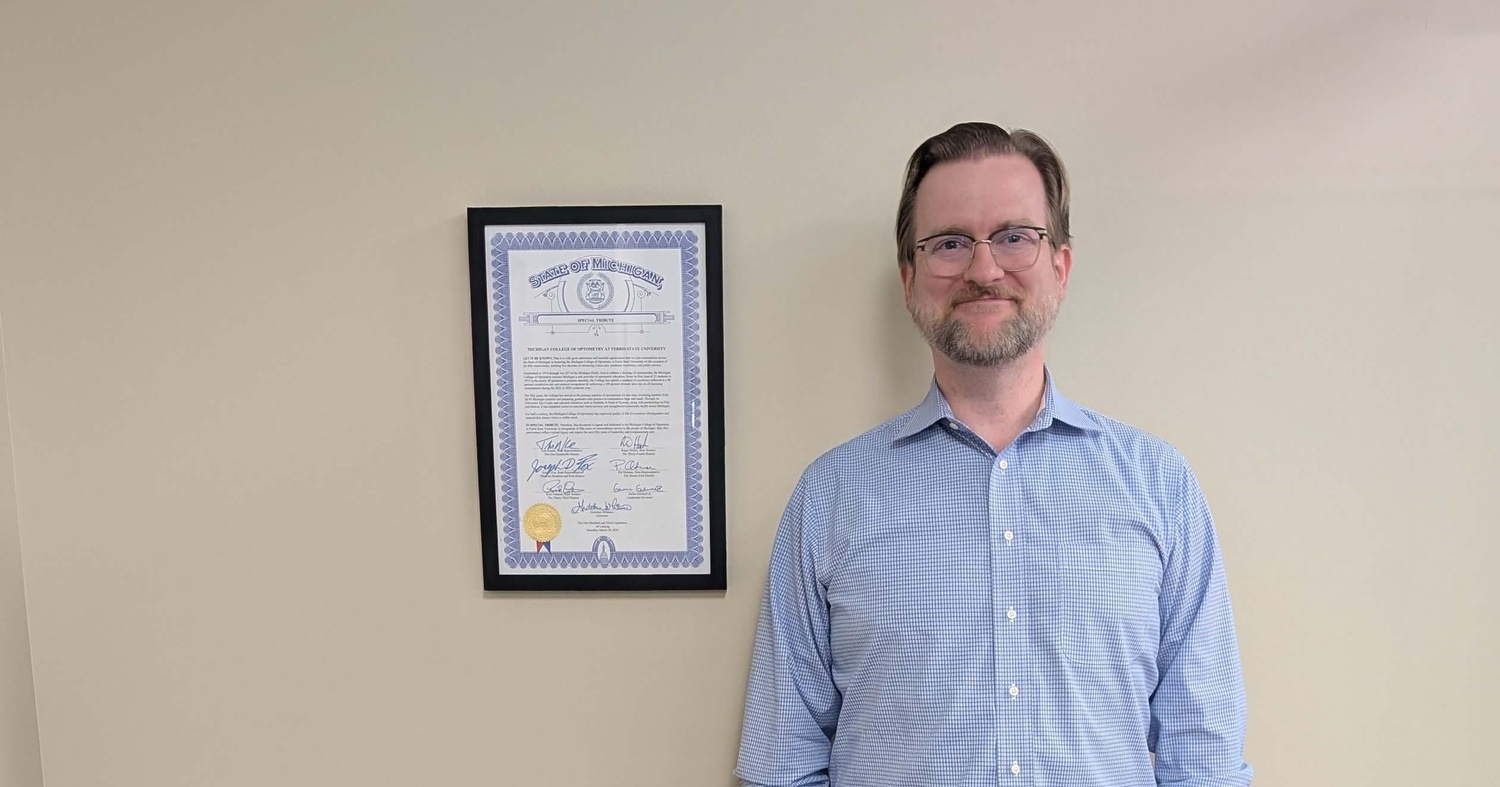 Dean Taylor posing with the signed certificate