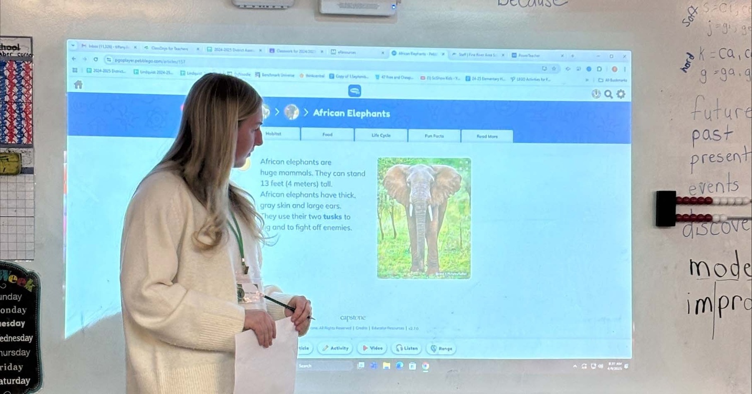 Sikorski giving a lesson to elementary students