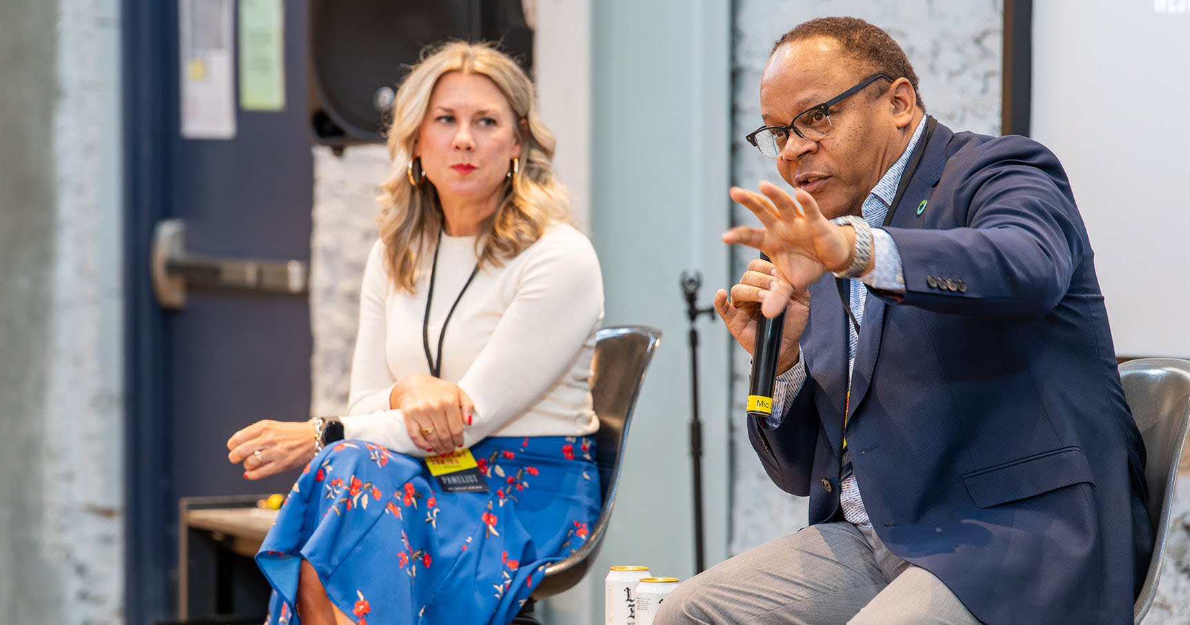 Speakers sharing the mic at Confluence 2025.