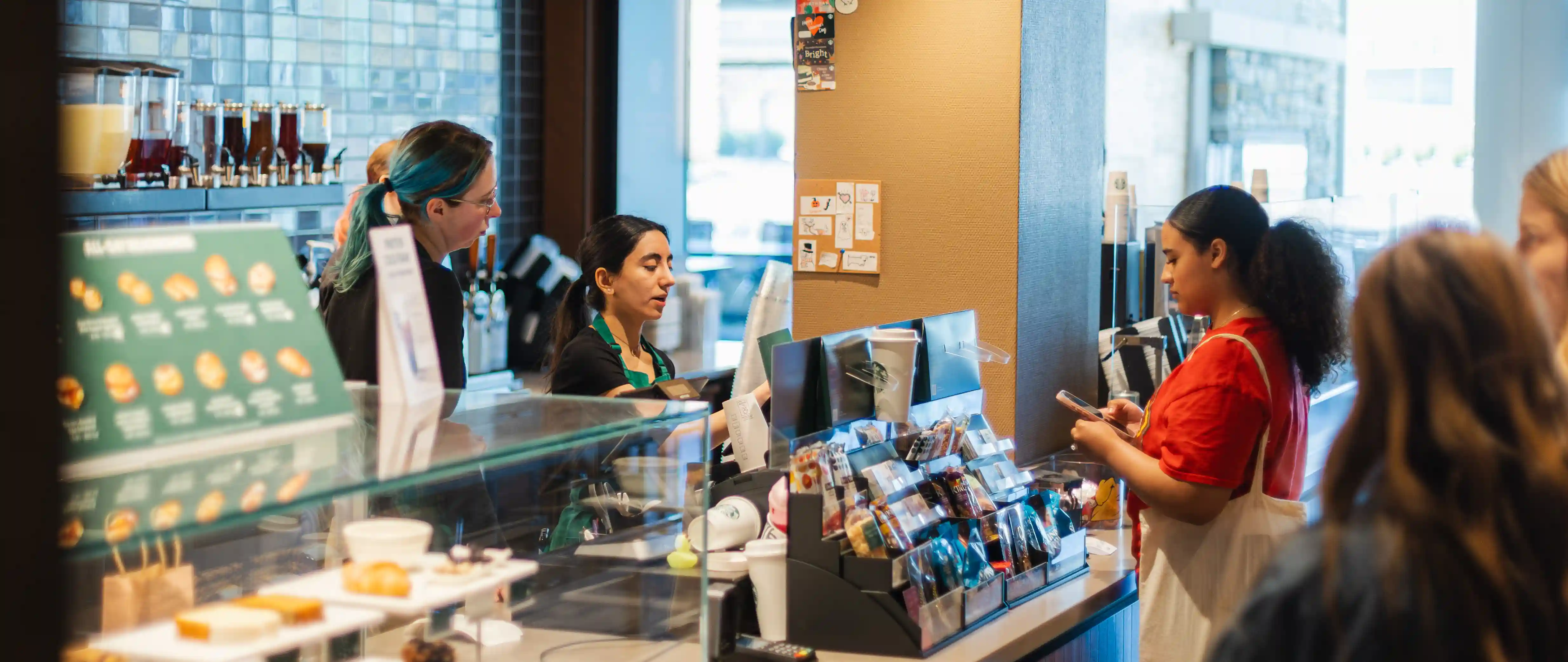 An individual ordering at the starbucks counter
