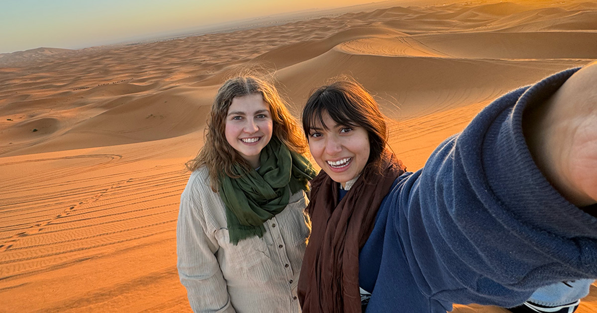 ferris state university students studying aborad in morocco standing on sand dunes