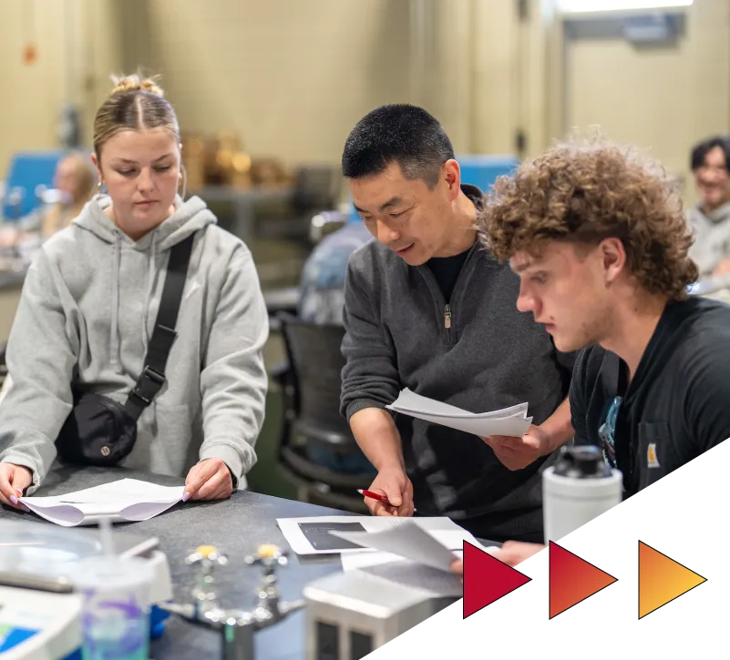 Students working with a faculty member in the construction lab at Ferris State University
