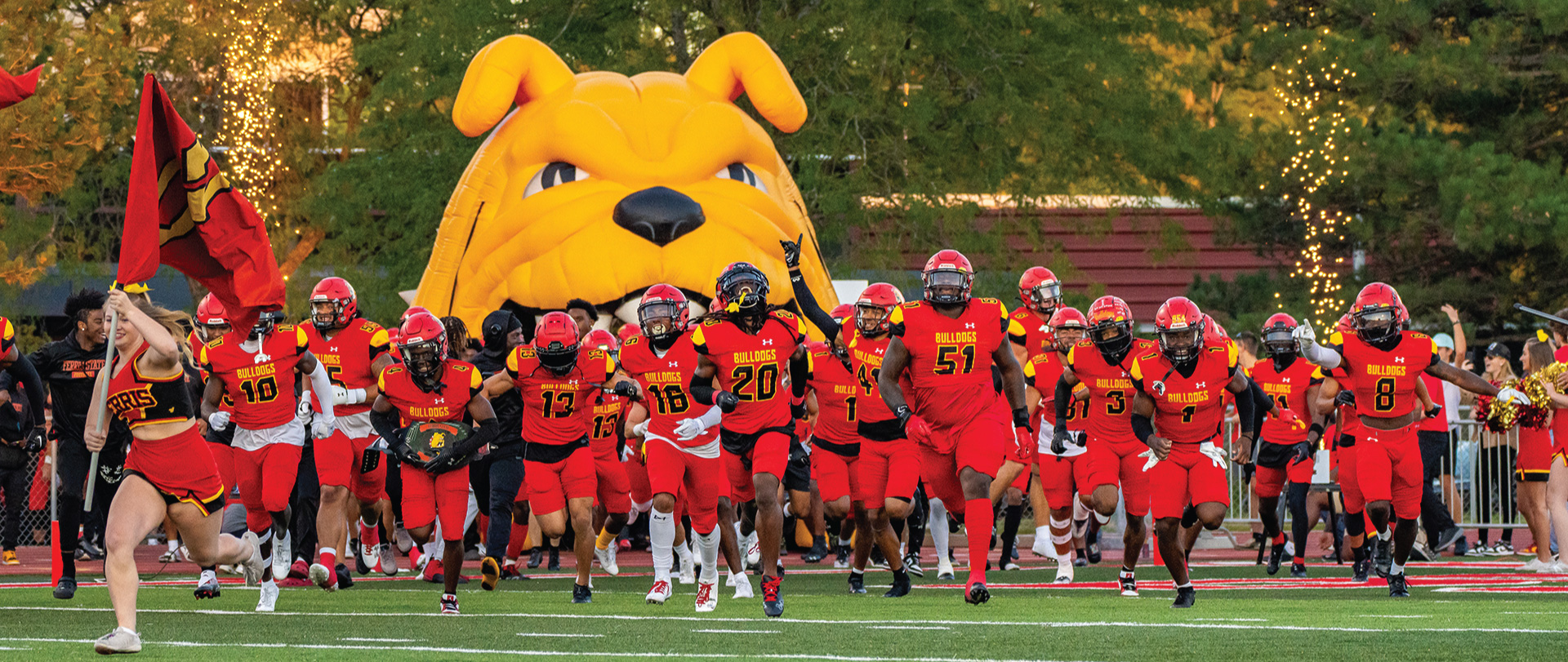 Ferris State football team running on the field in 2023 home opener
