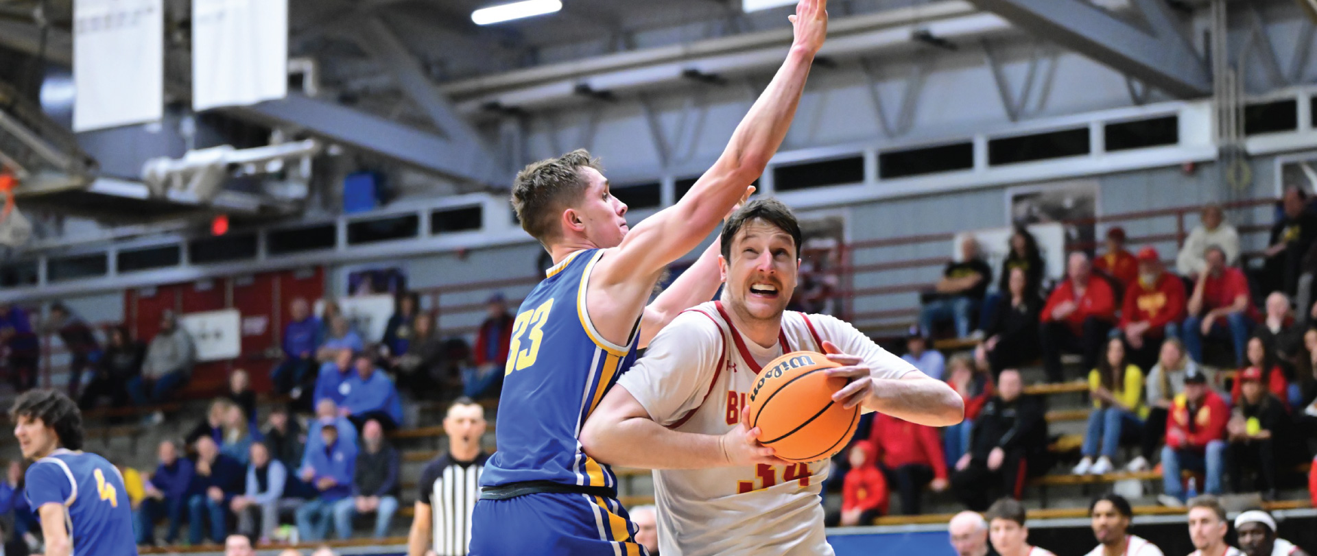 Ferris Men's Basketball's Vejas Grazulis driving to the net during their Sweet Sixteen game against LSSU