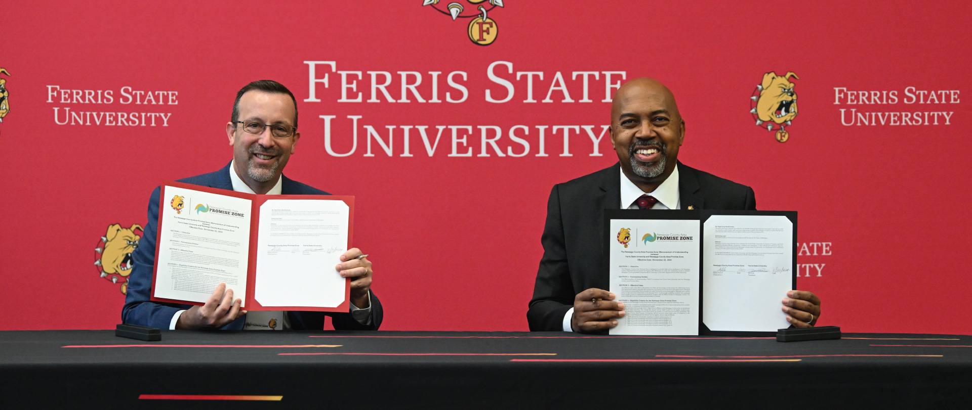 Newaygo County Area Promize Zone Chairperson Blake Prewitt, left, and Ferris State President Bill Pink after signing the agreement