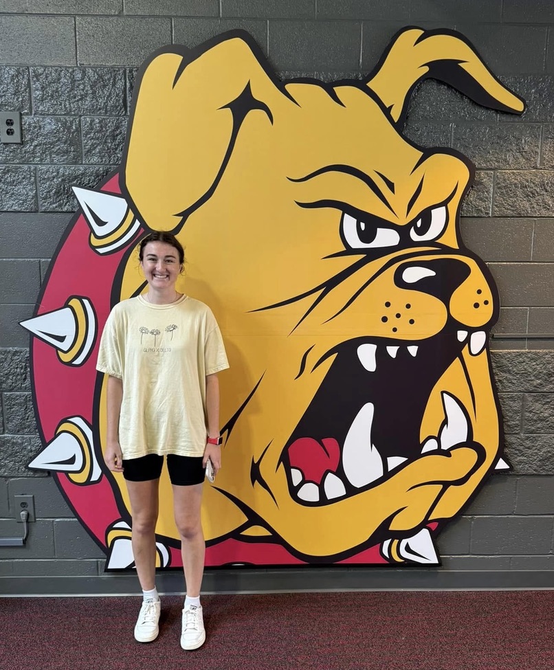 student in front of bulldog
