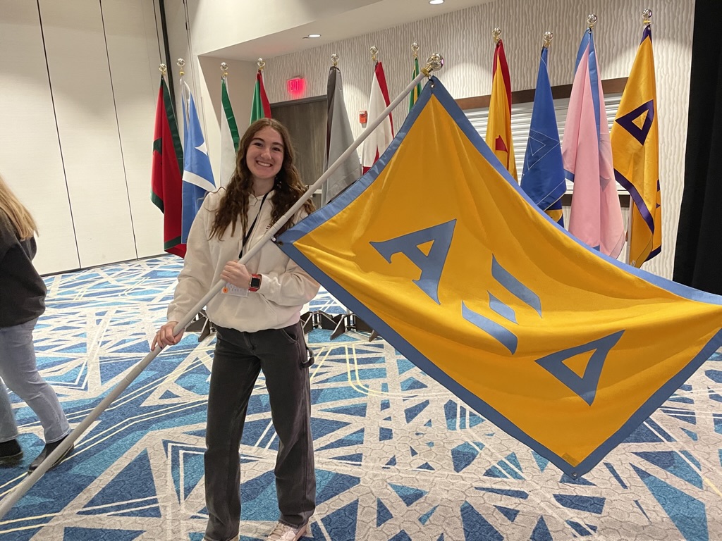 student with a flag