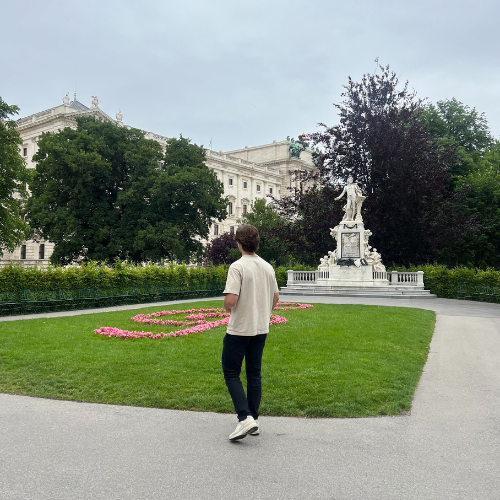 man in front of a garden