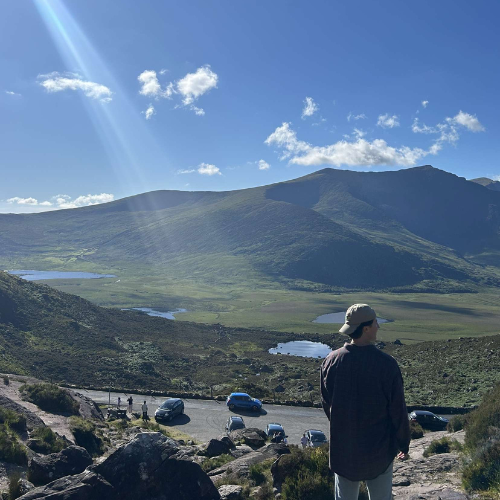 man infront of a mountain