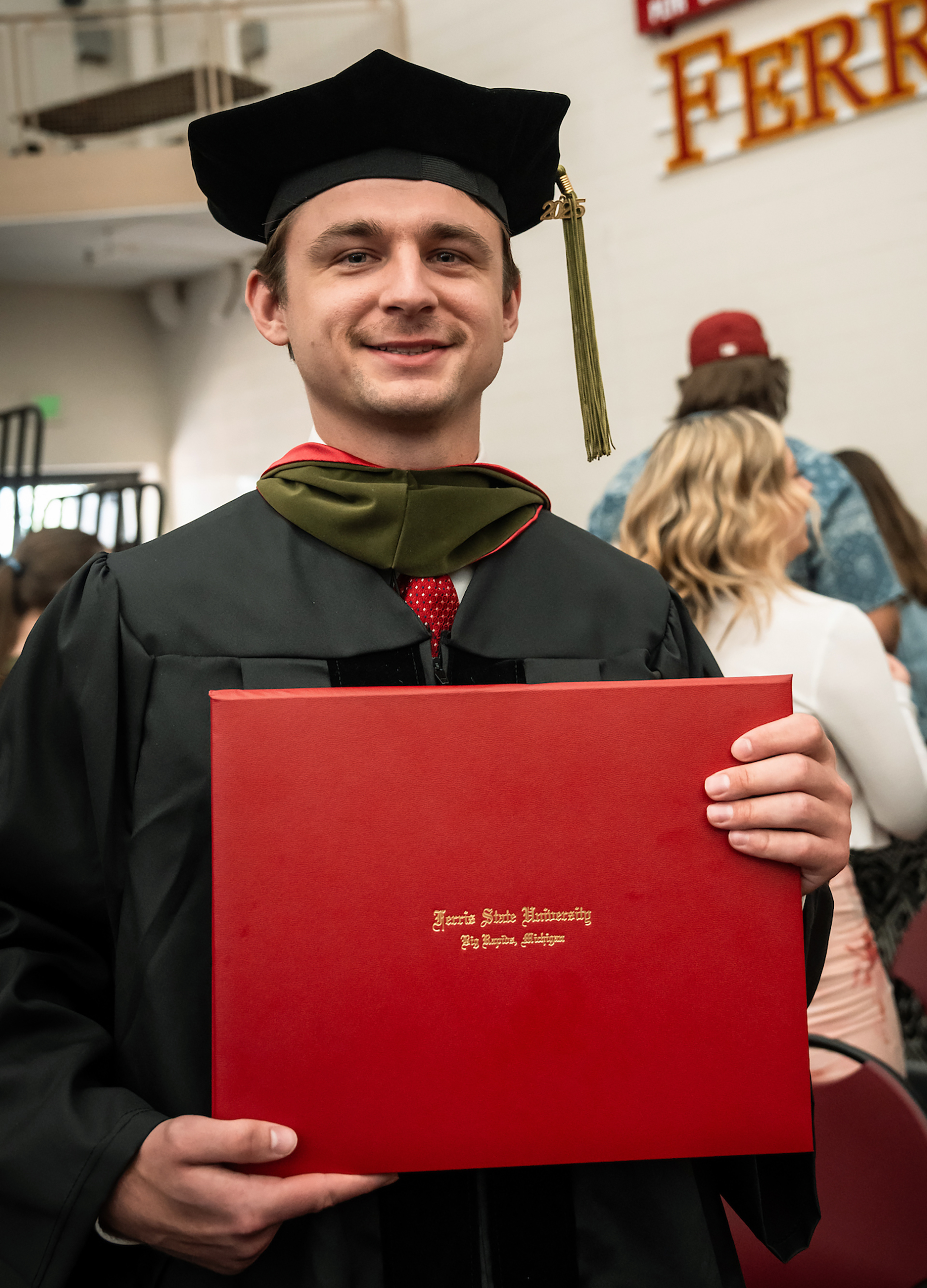 Lucas Finner Bulldog hockey alum earns Doctor of Pharmacy