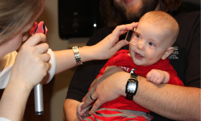 Infant receiving an exam