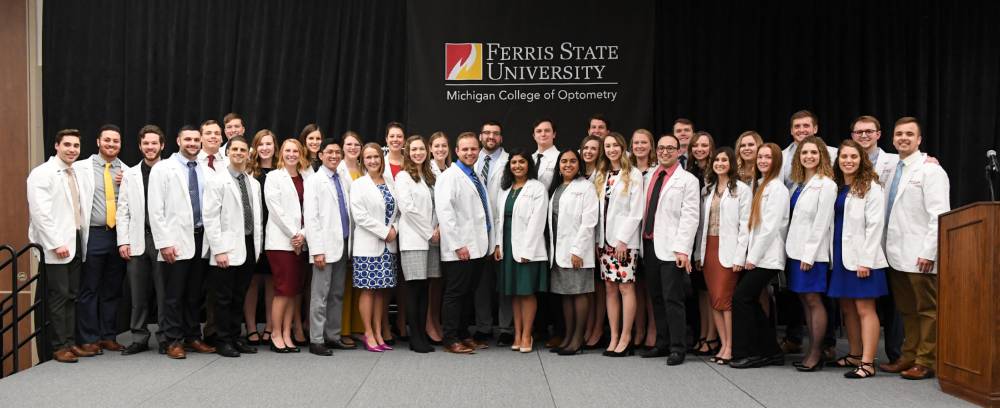 Students posing for a group photo at the White Coat ceremony for the class of 2022