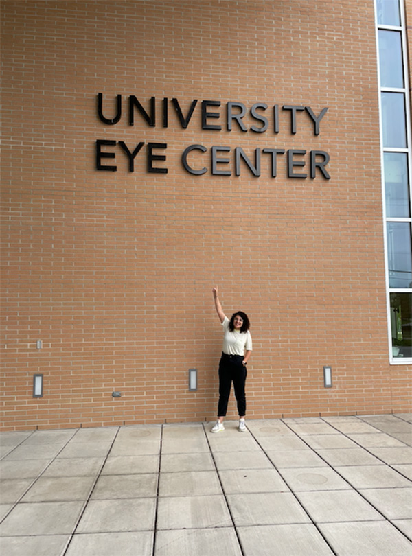 Anita Kamran posing in front of the University Eye Center