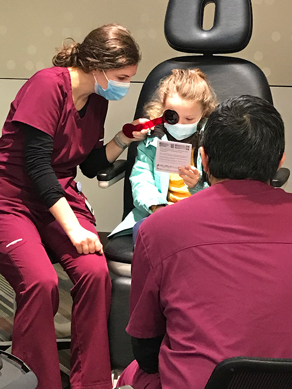 MCO students with young patient