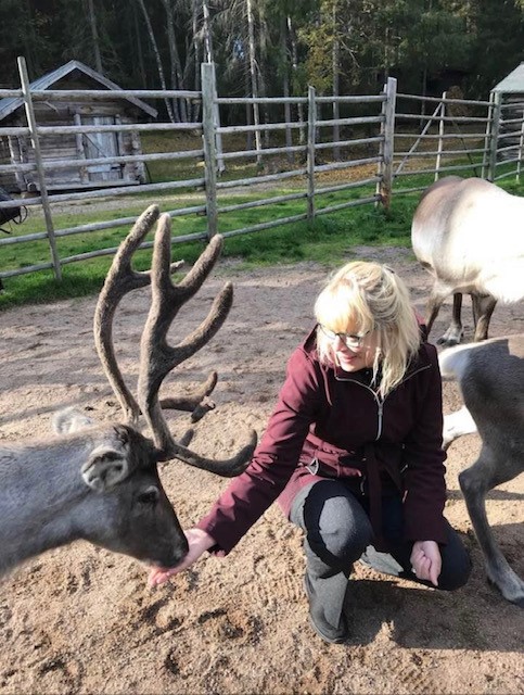 Dr. Moore and a reindeer