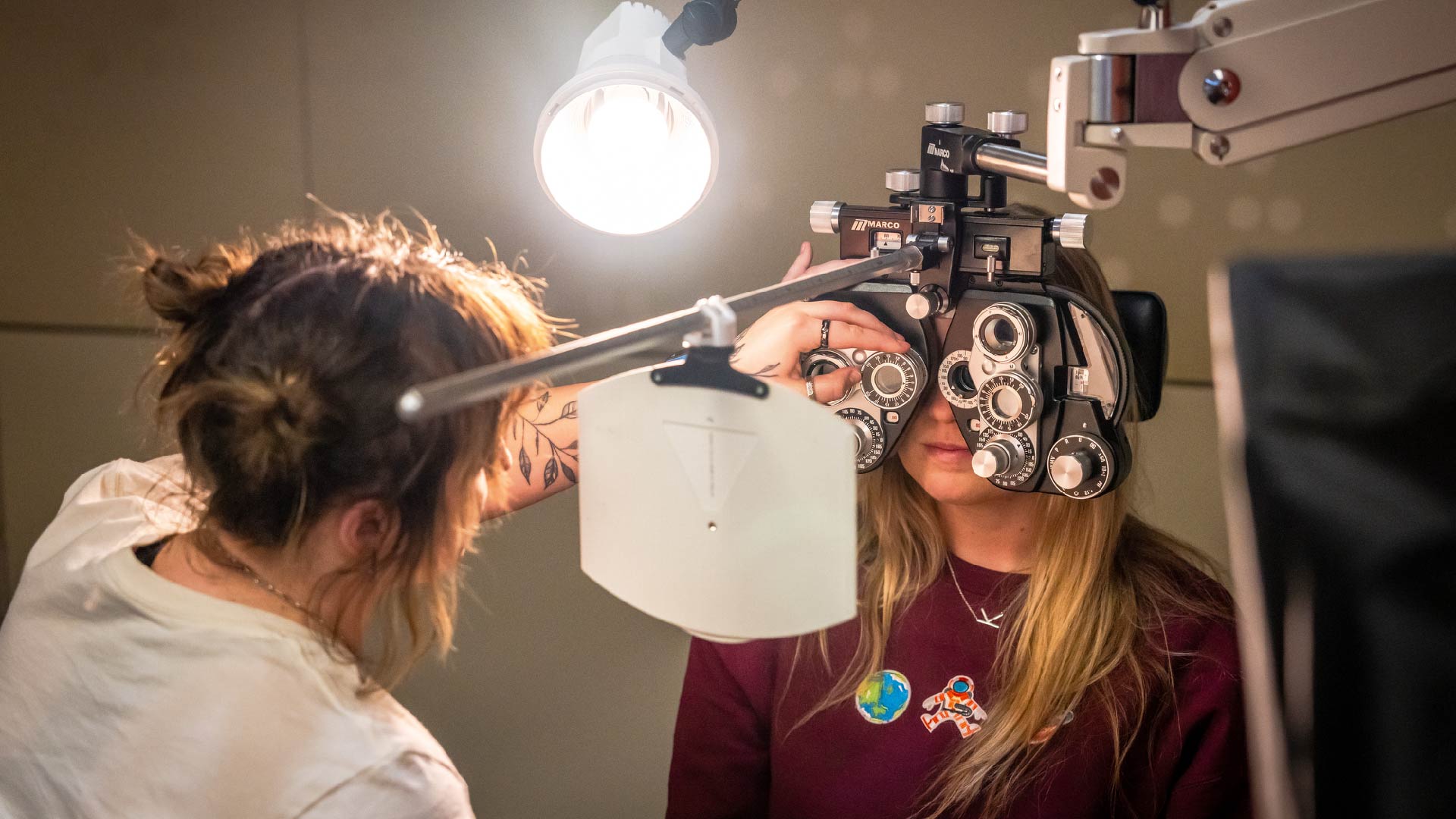 Student completing an eye exam