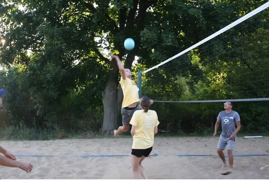 Students playing volleyball