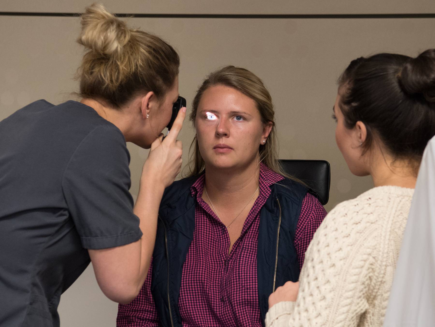 Student performing an eye exam