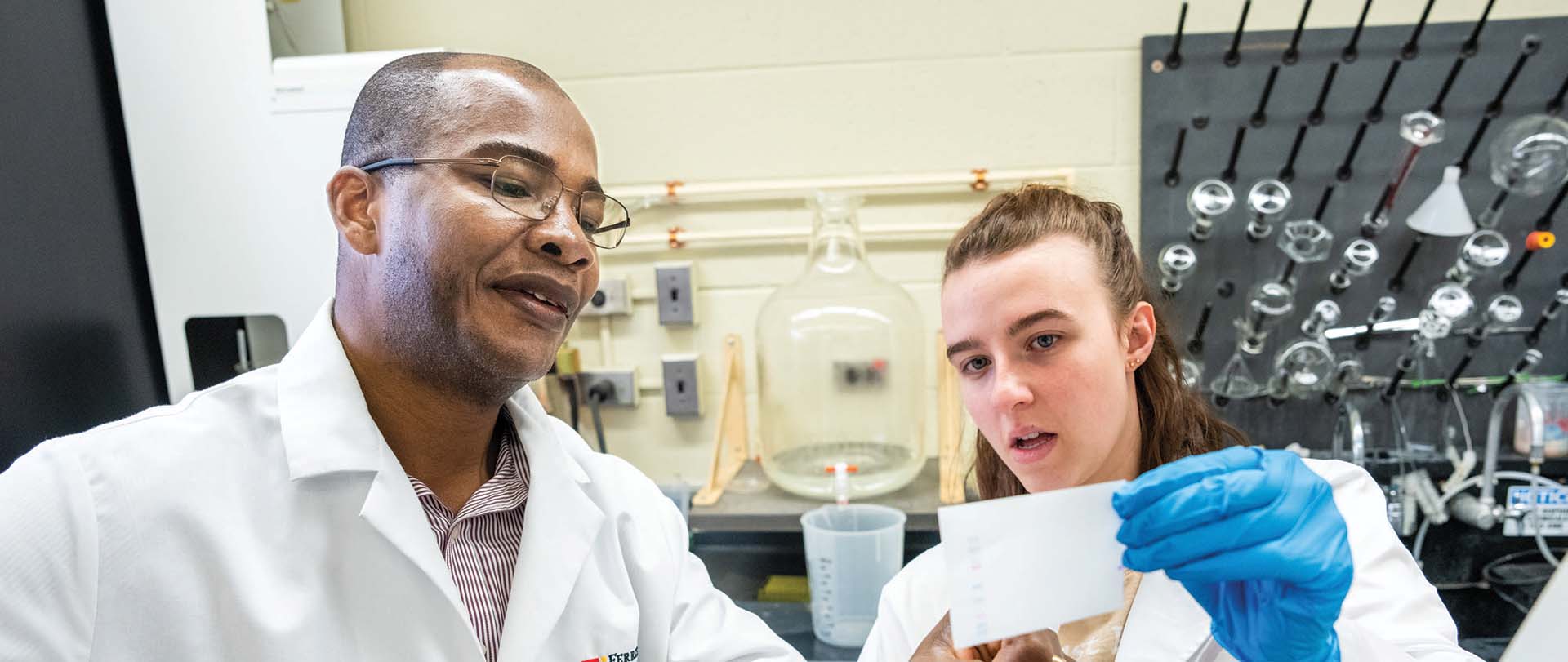 Student and professor working in lab