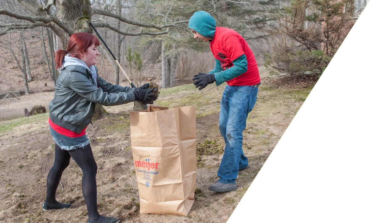 Two students doing yard work at the BIG Event