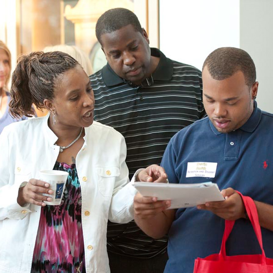 student discussing with parents