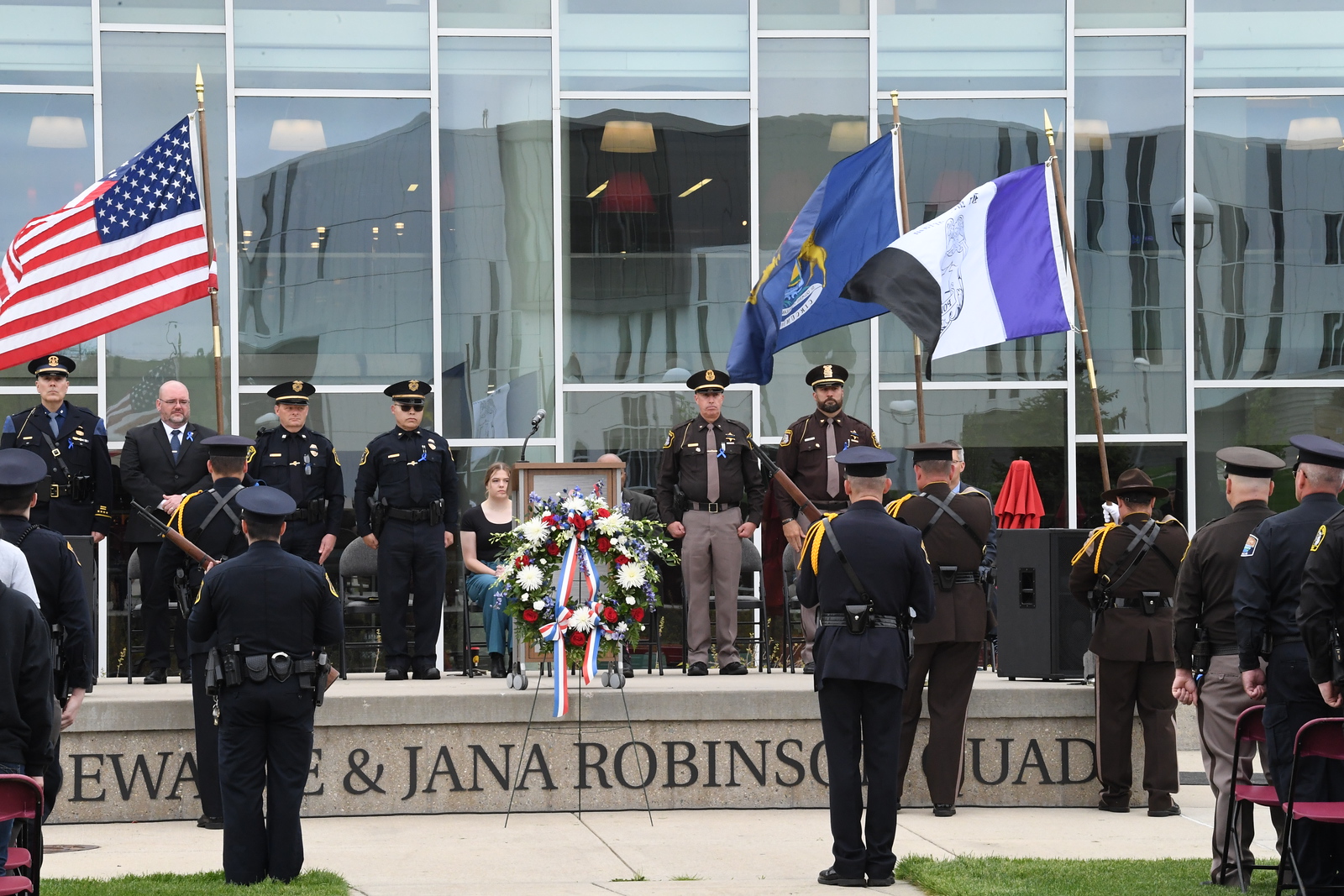 People attending the police memorial paying tribute to fallen officers.